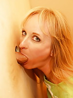 This horny blonde mature slut loves a cock coming through a hole